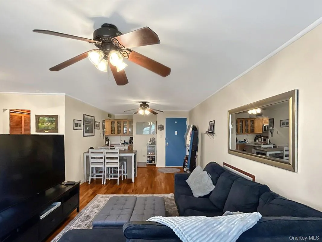 Hardwood flooring extends throughout the living area Hardwood flooring extends throughout the living area