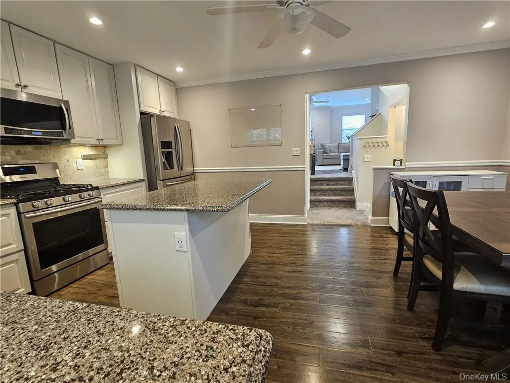 Large Kitchen with Island and Dining Area Large Kitchen with Island and Dining Area