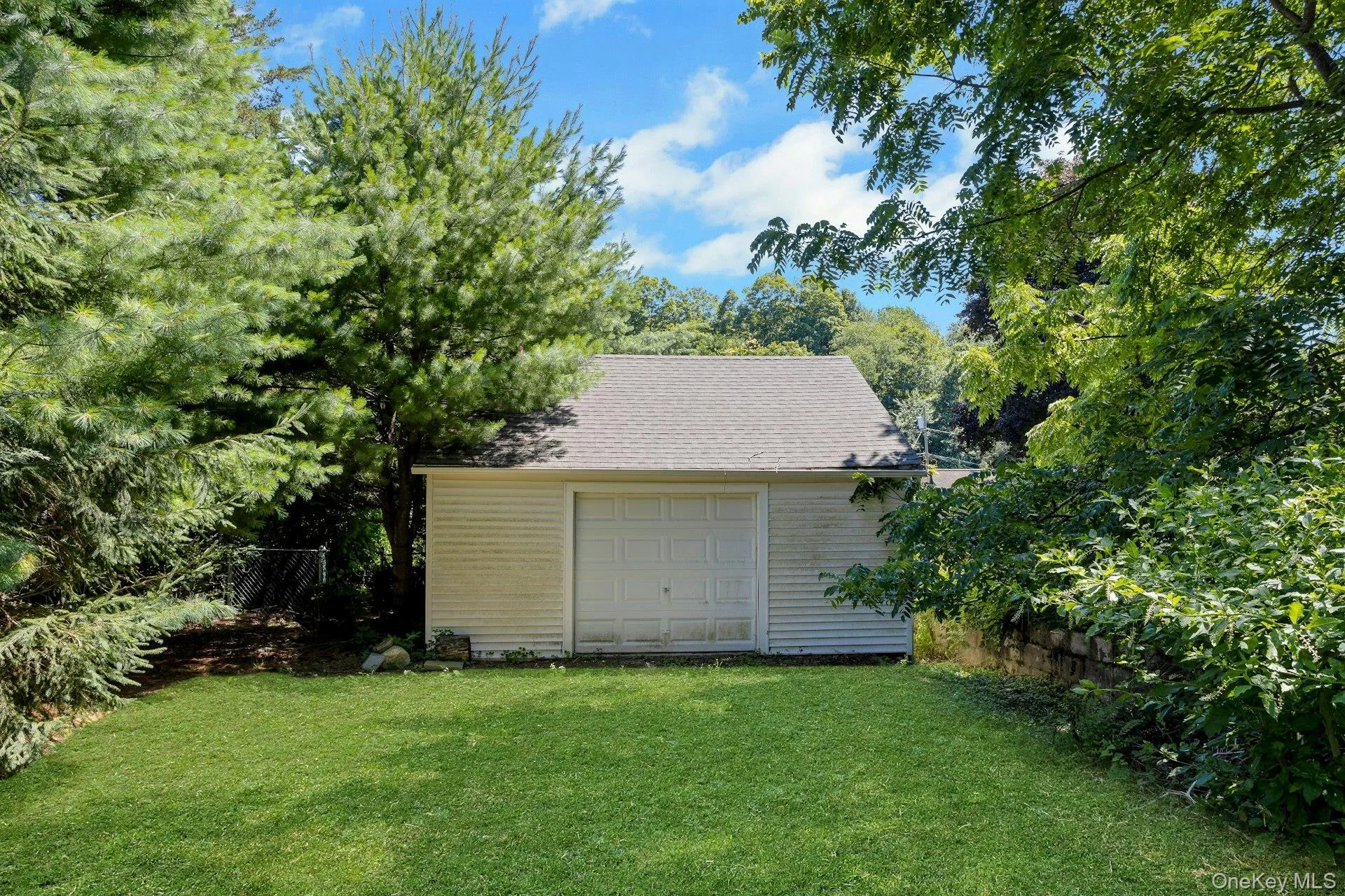 located on rear of propertylarge garage with storage room. located on rear of propertylarge garage with storage room.