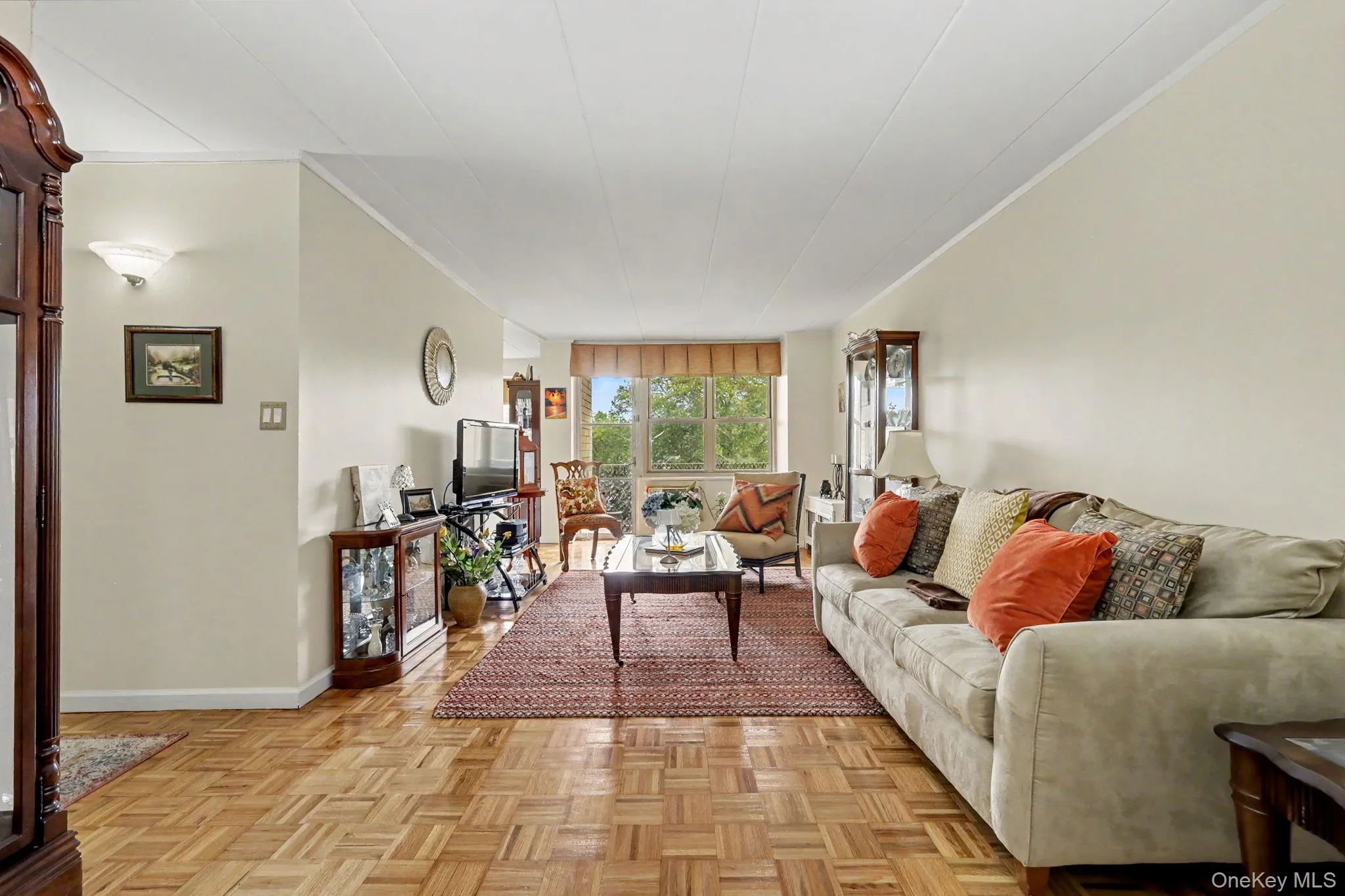 Enjoy the Living Room with your Balcony, Parquet wood-finish flooring, neutral wall tones, and built-in wall sconce lighting Enjoy the Living Room with your Balcony, Parquet wood-finish flooring, neutral wall tones, and built-in wall sconce lighting