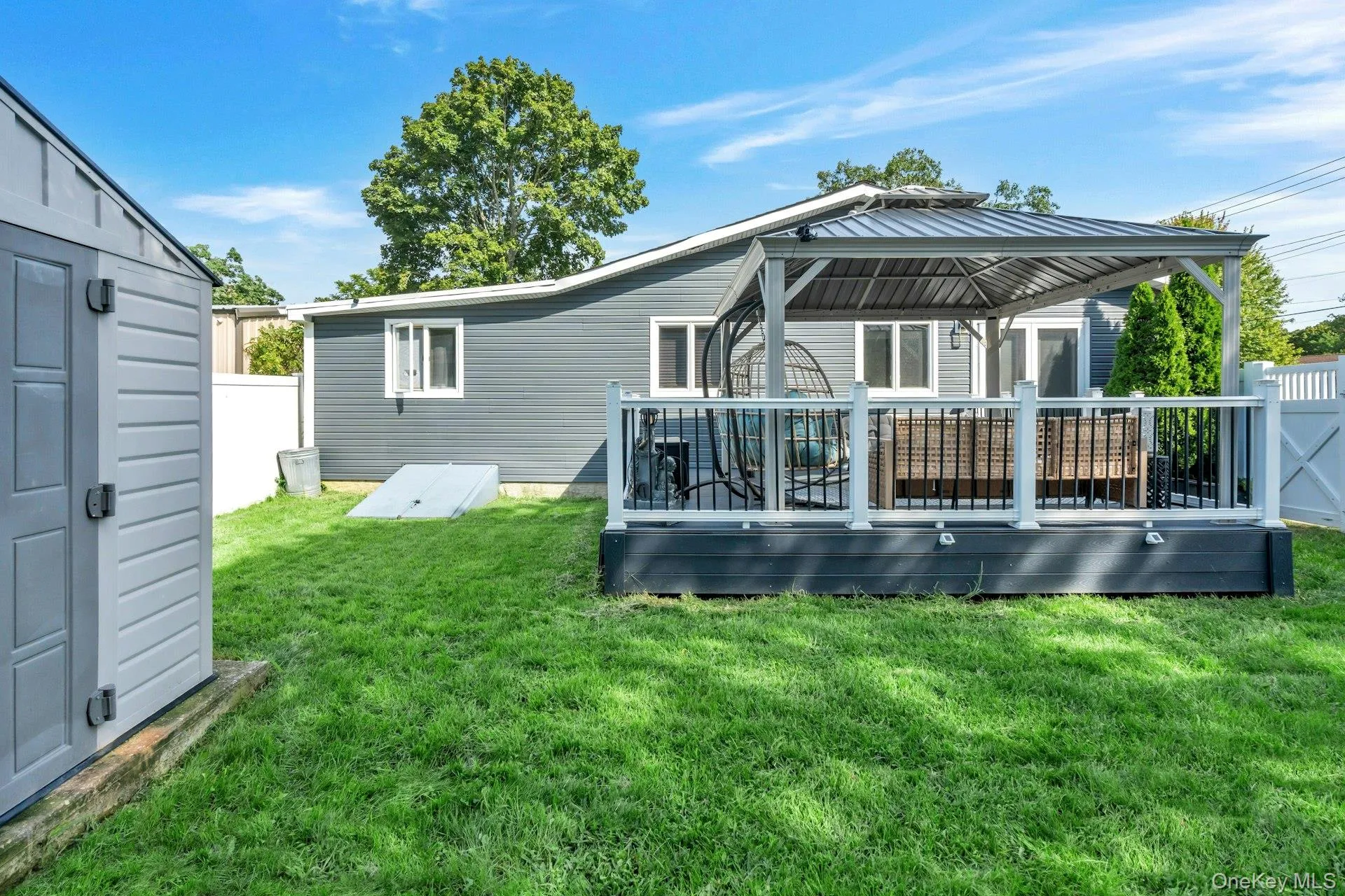 Another view of the deck, another storage shed and entry to the basement. Another view of the deck, another storage shed and entry to the basement.