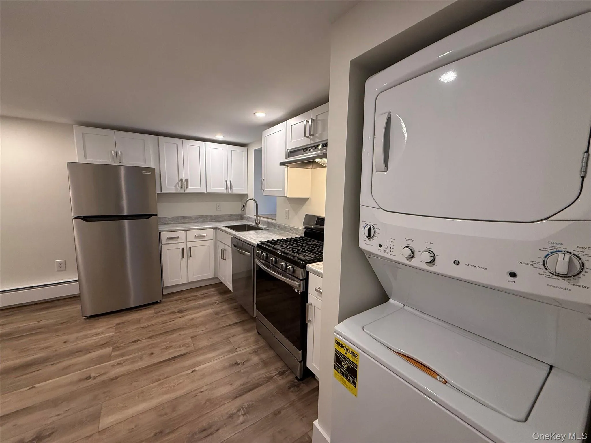 View of side kitchen with laundry unit View of side kitchen with laundry unit