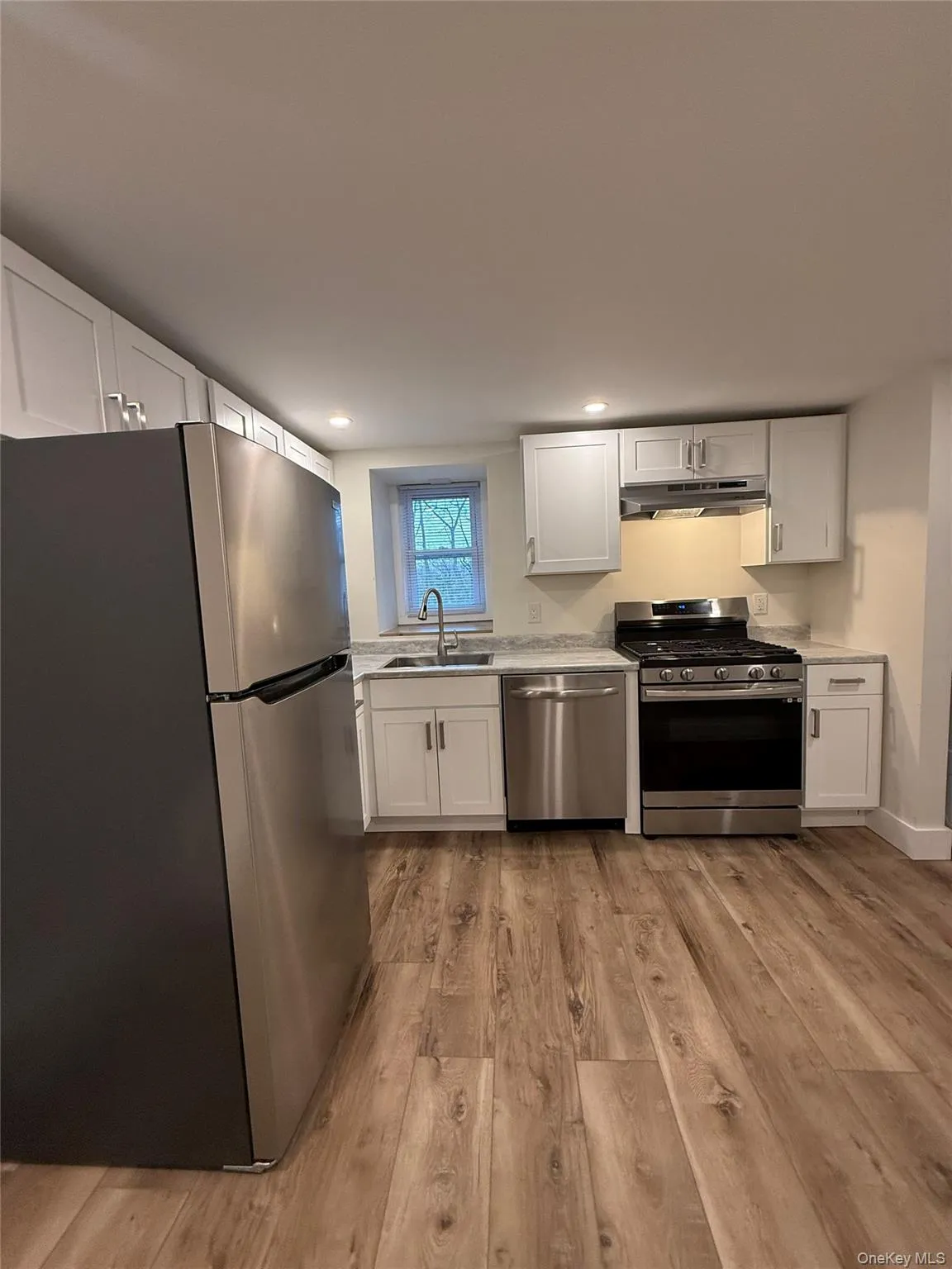 Kitchen with dishwasher, stove, and refrigerator Kitchen with dishwasher, stove, and refrigerator