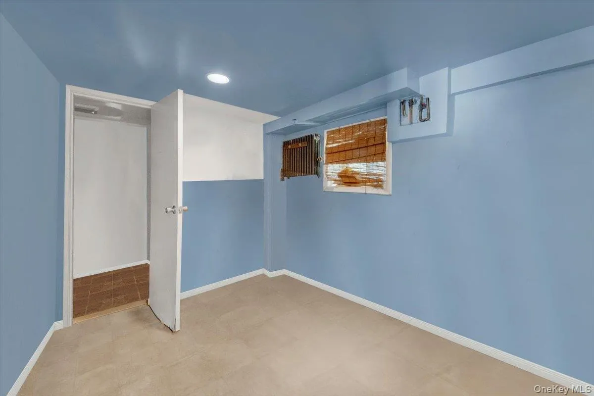 Unfurnished bedroom with baseboards and recessed lighting Unfurnished bedroom with baseboards and recessed lighting