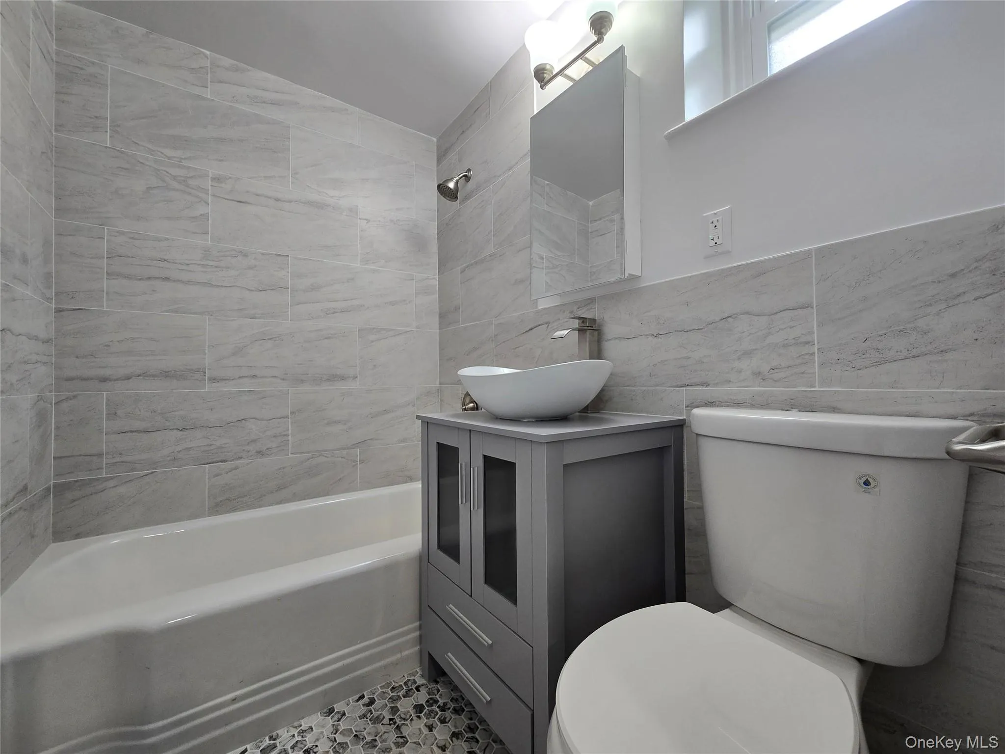 Newly Installed vanity and toilet with floor and wall tiles and lighting fixture with medicine box. It comes with new water and sewer pipes. Newly Installed vanity and toilet with floor and wall tiles and lighting fixture with medicine box. It comes with new water and sewer pipes.