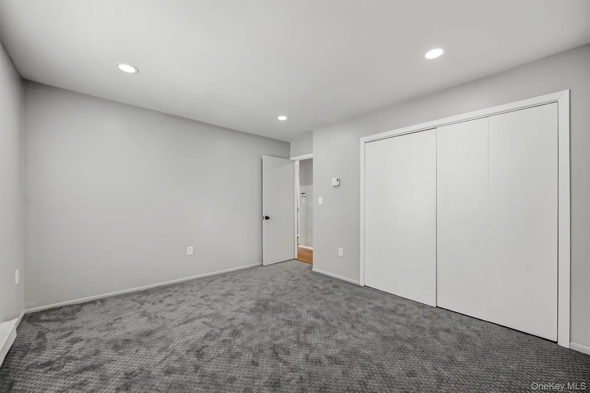 Additional guest bedroom view with a large window and generous closet space. Additional guest bedroom view with a large window and generous closet space.