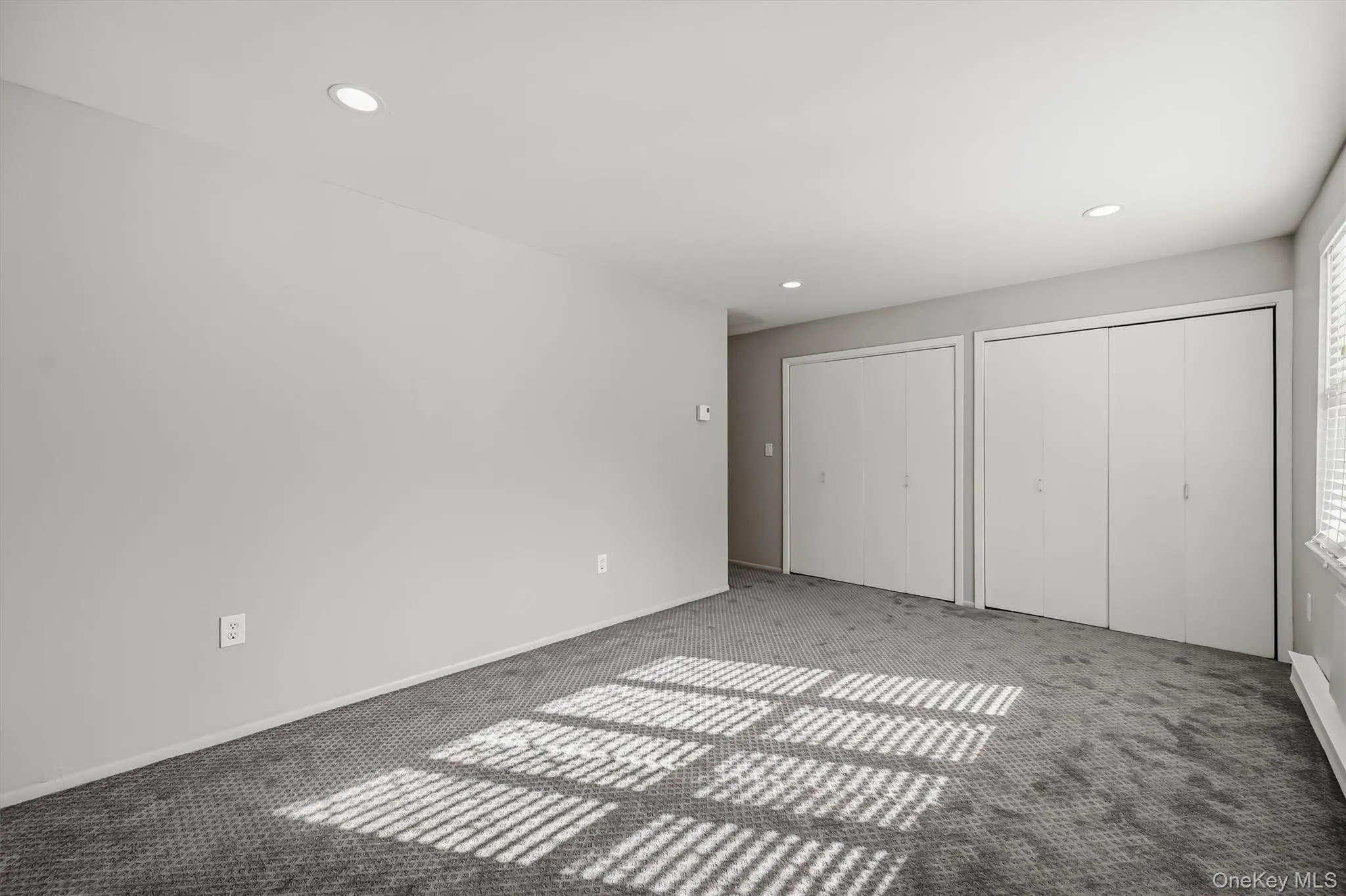 Additional primary bedroom view with recessed lighting and lots of wall space. Additional primary bedroom view with recessed lighting and lots of wall space.