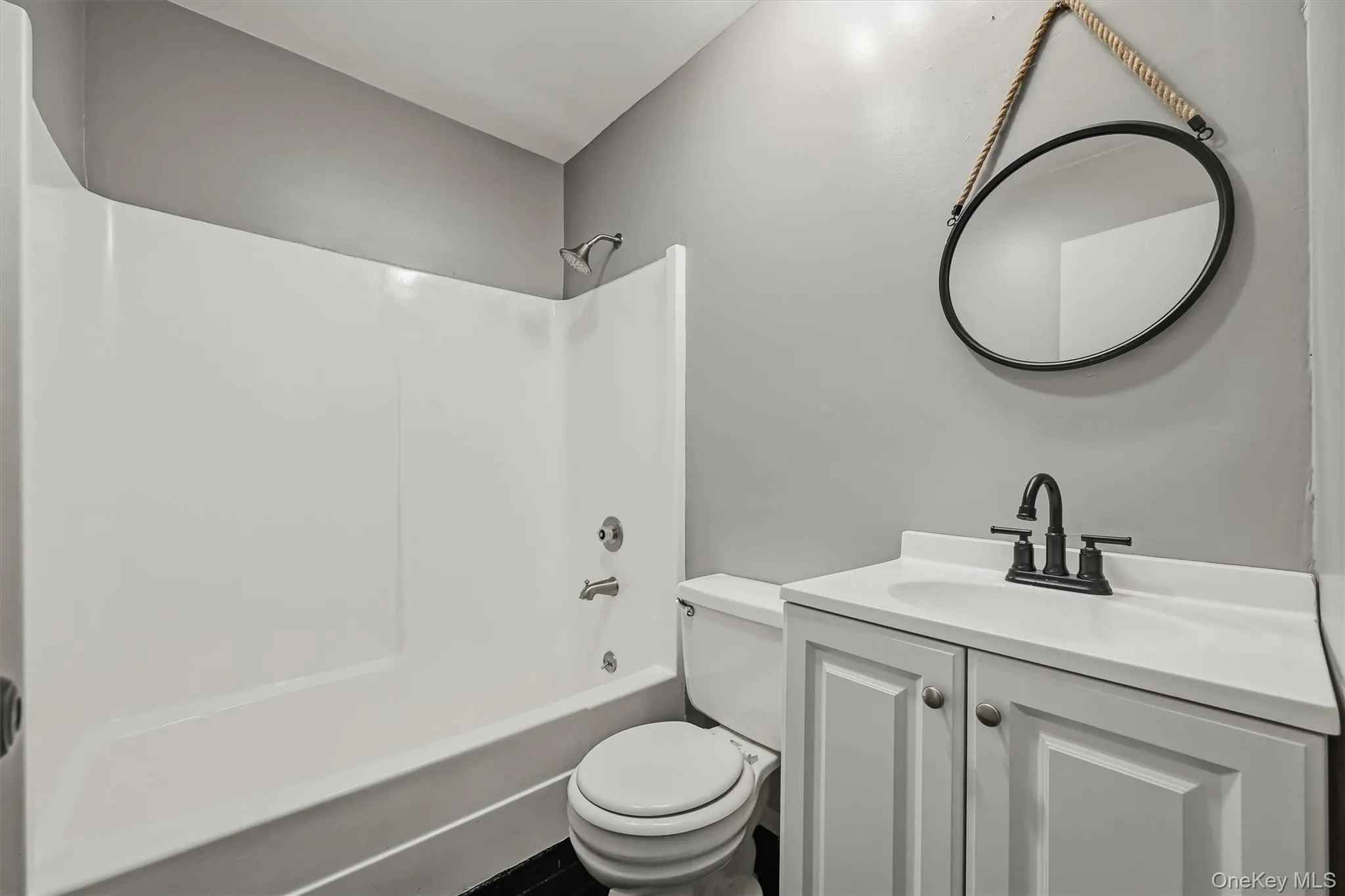 Full bathroom with a tub and shower combination, vanity, and updated fixtures. Full bathroom with a tub and shower combination, vanity, and updated fixtures.