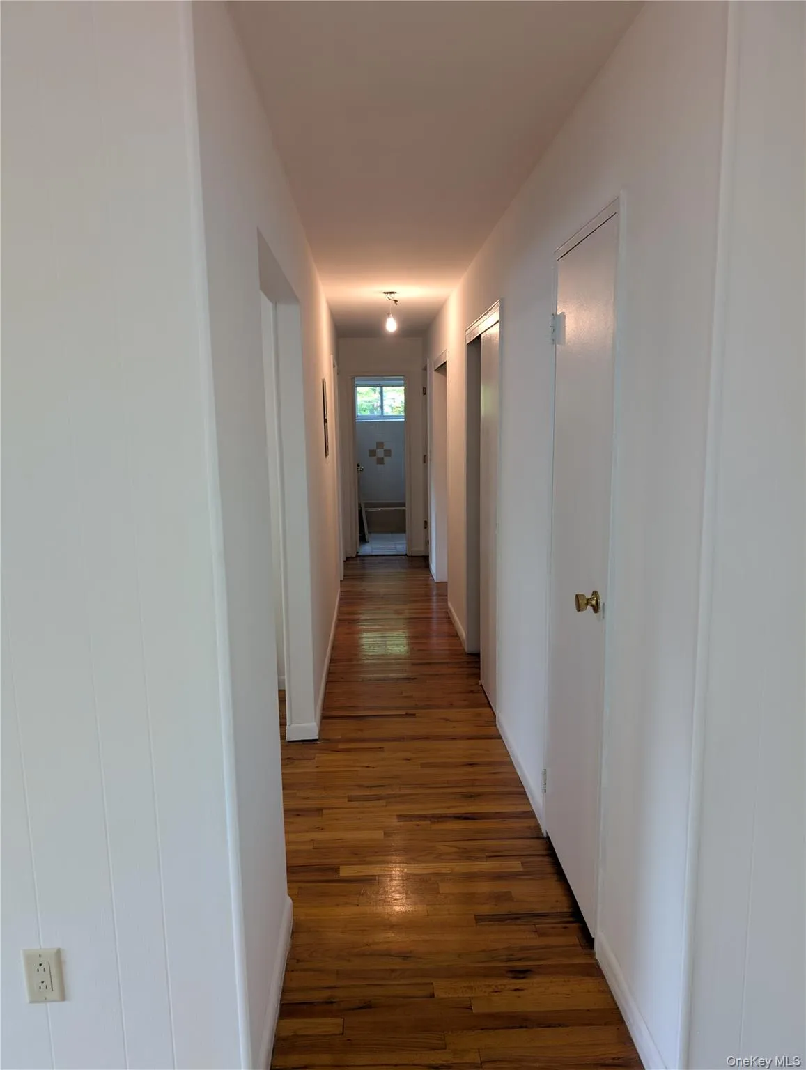 Hardwood floors with entire wall of closets for storage Hardwood floors with entire wall of closets for storage