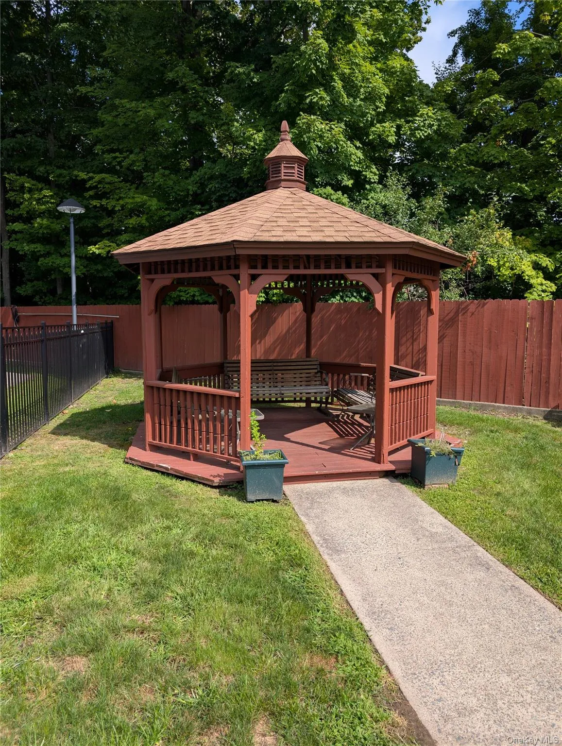 Gazebo located near the pool area Gazebo located near the pool area