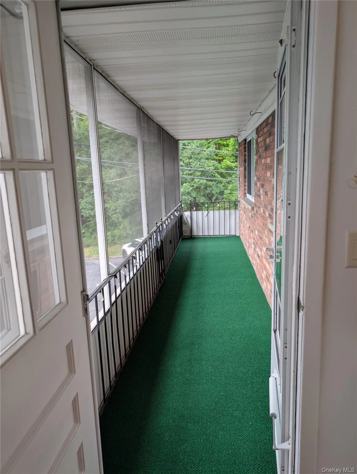 Screened porch with indoor/outdoor carpeting and Edison lights Screened porch with indoor/outdoor carpeting and Edison lights