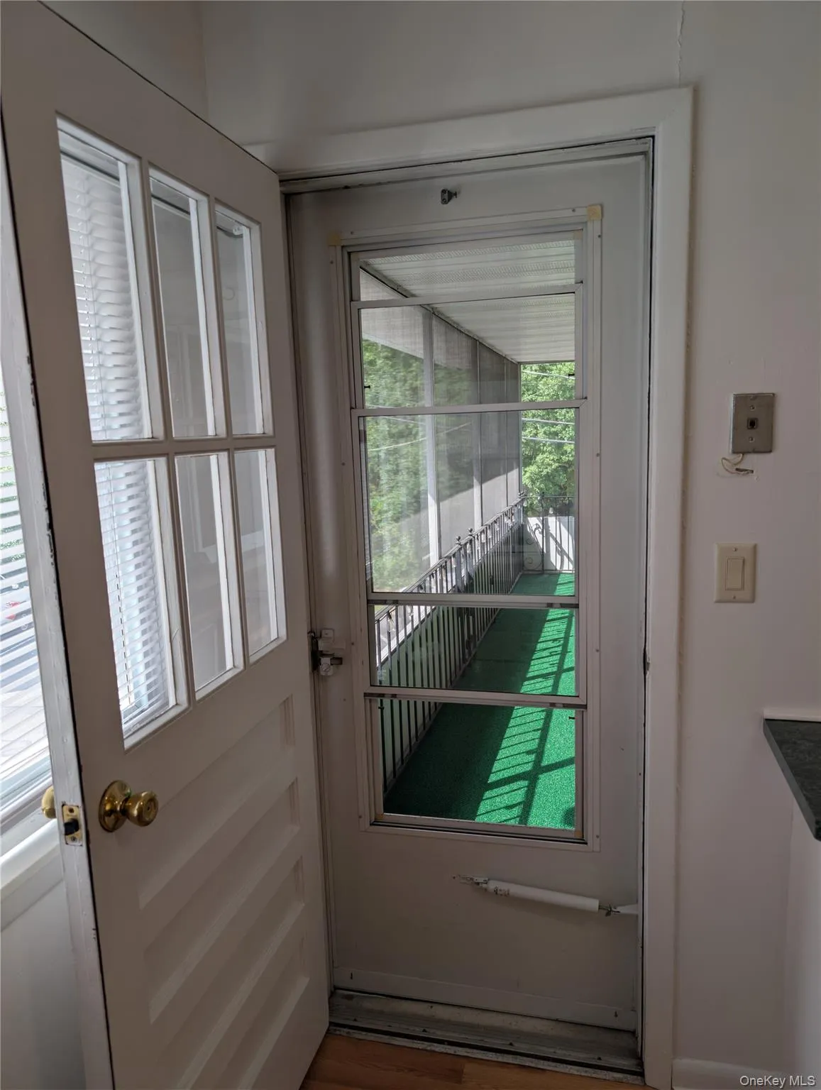 Entrance to screened room off the kitchen Entrance to screened room off the kitchen