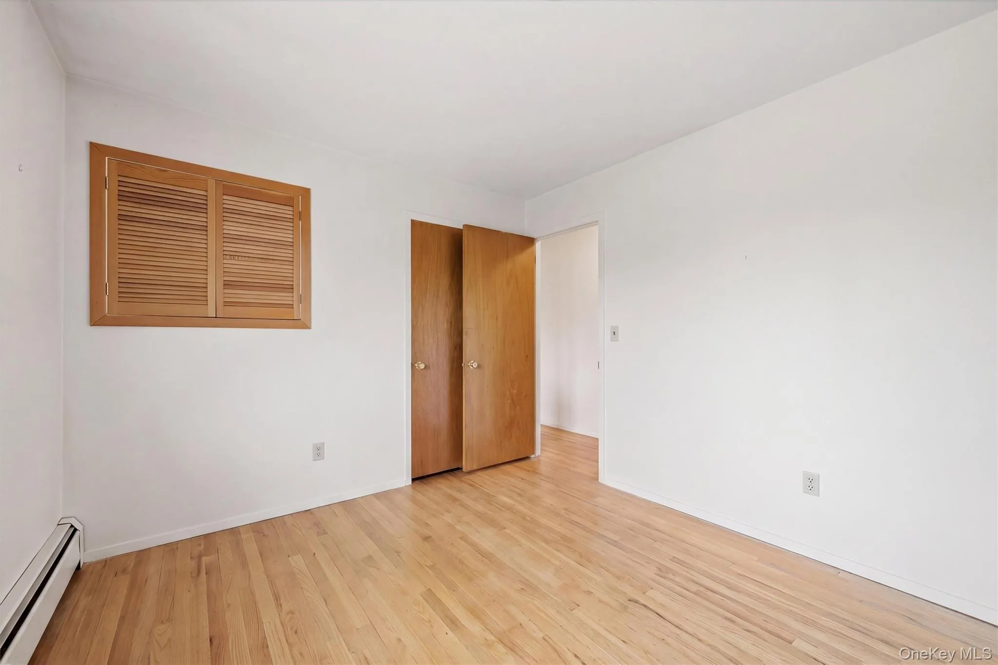 bedroom 2 Hardwood flooring throughout, warm wood-finish doors bedroom 2 Hardwood flooring throughout, warm wood-finish doors