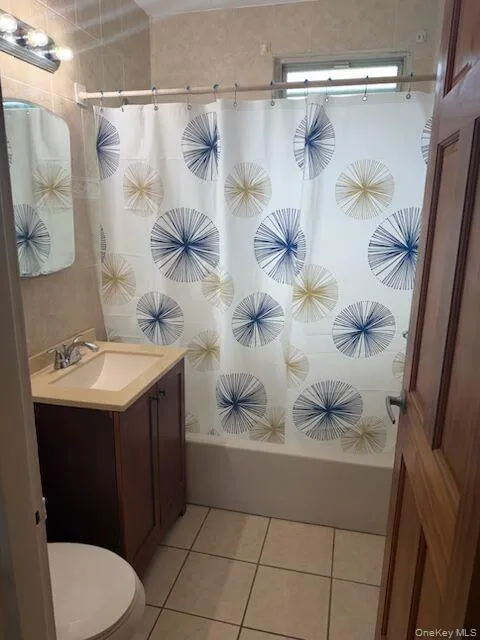 Windowed bathroom, tiles floor to ceiling with ceramic floor as well. Windowed bathroom, tiles floor to ceiling with ceramic floor as well.