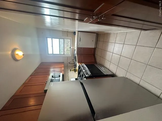 Granite appliances, including dishwasher and microwave. Ceramic tile floor. Granite appliances, including dishwasher and microwave. Ceramic tile floor.