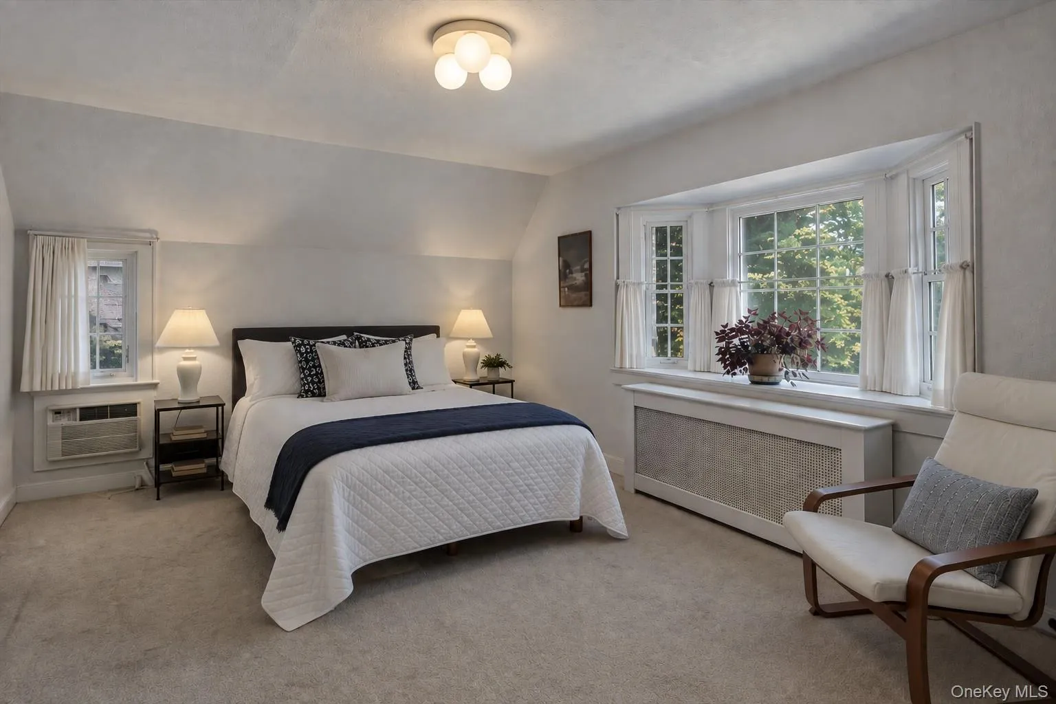 Spacious primary bedroom with en suite bath and access to walk-up attic. Spacious primary bedroom with en suite bath and access to walk-up attic.