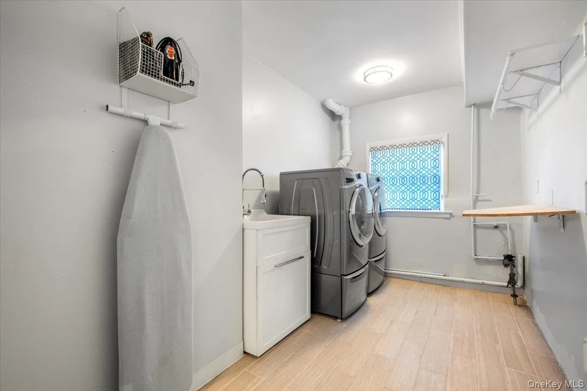 Separate laundry room is off the lower level family room, with access to basement and garage Separate laundry room is off the lower level family room, with access to basement and garage