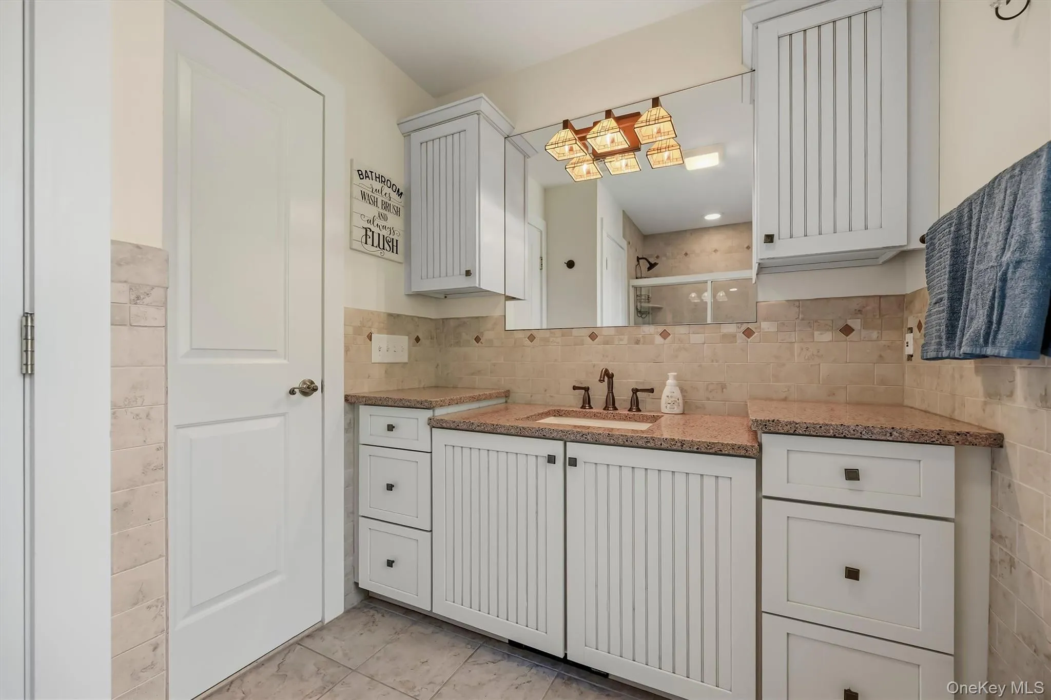 Convenient second-level hall bath with plenty of storage overlooking the lake. Convenient second-level hall bath with plenty of storage overlooking the lake.