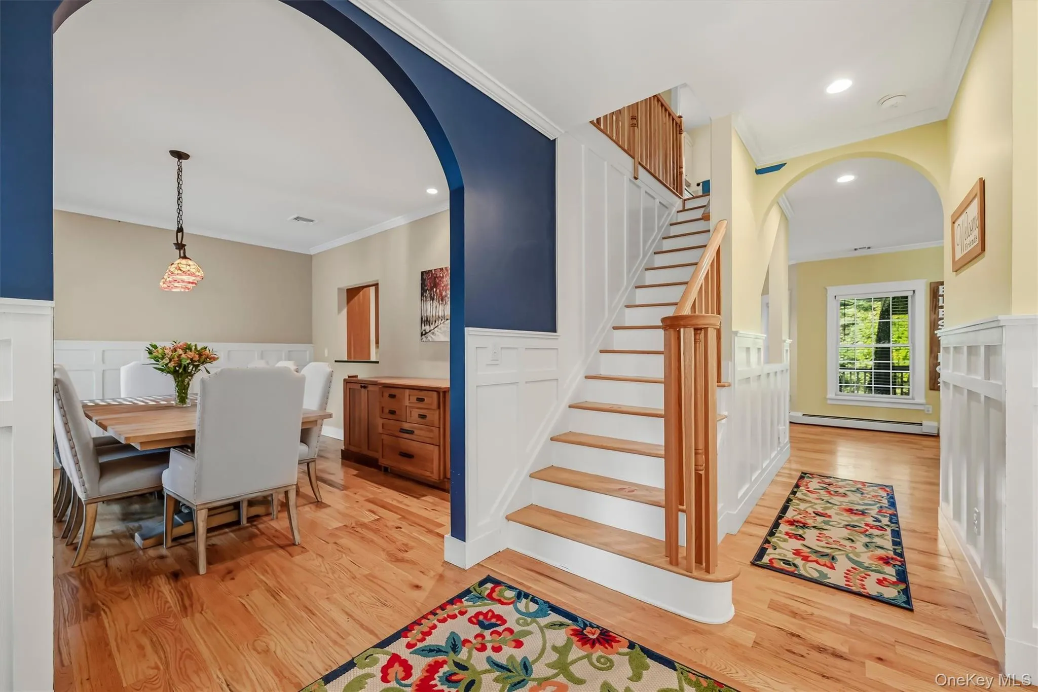Welcoming entry with timeless architectural details including beautiful hardwood floors and classic picture-frame moulding. Welcoming entry with timeless architectural details including beautiful hardwood floors and classic picture-frame moulding.