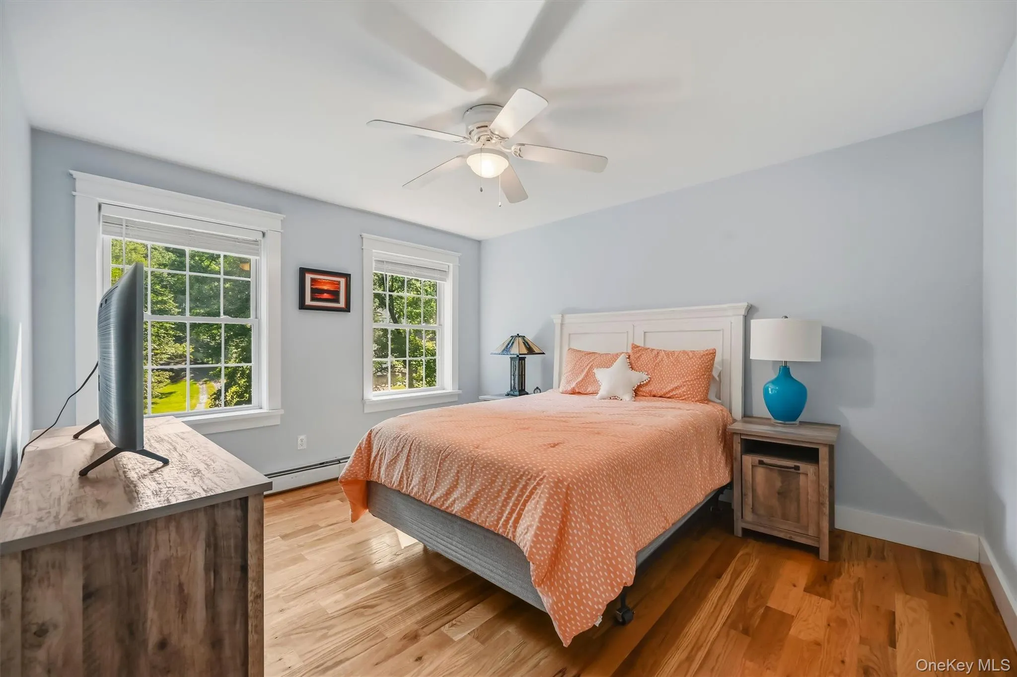 Sun-filled guest bedroom offering a comfortable retreat for overnight guests. Sun-filled guest bedroom offering a comfortable retreat for overnight guests.