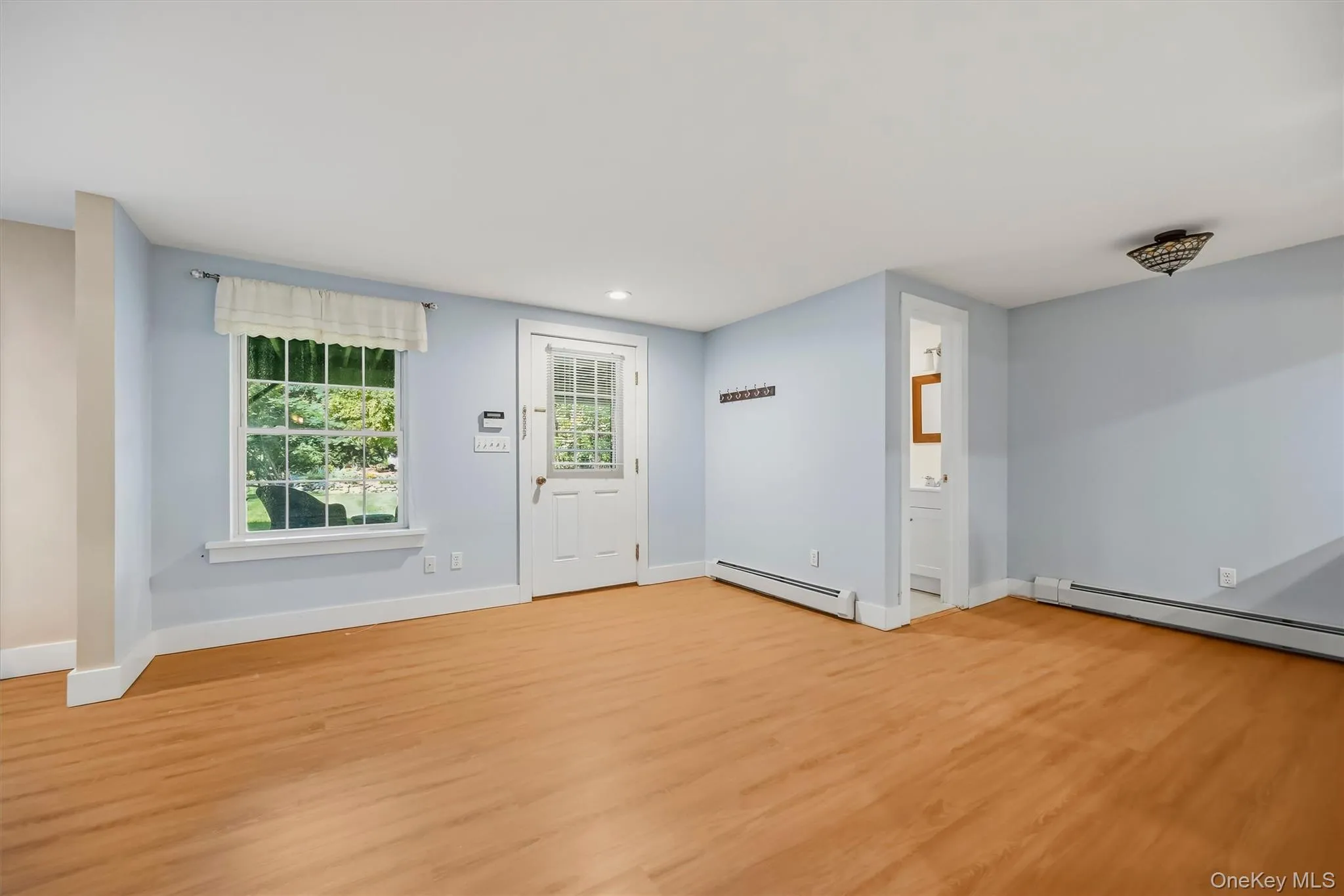 Expansive finished lower level offers flexible space for entertaining, guests, or a home office, with easy walk-out access to the lakefront. Expansive finished lower level offers flexible space for entertaining, guests, or a home office, with easy walk-out access to the lakefront.