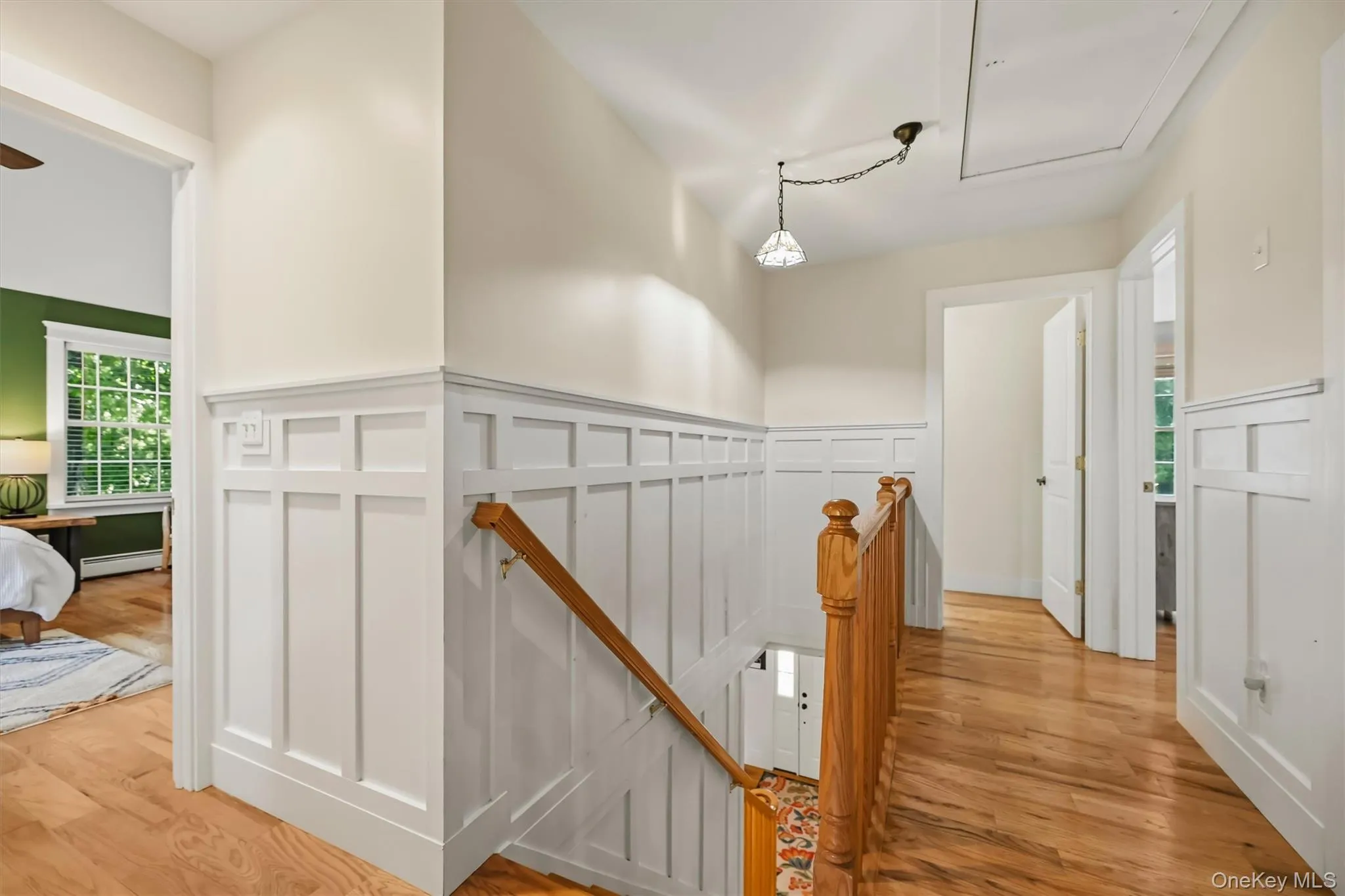 Beautifully detailed staircase with picture-frame molding ascending to the second level. Beautifully detailed staircase with picture-frame molding ascending to the second level.