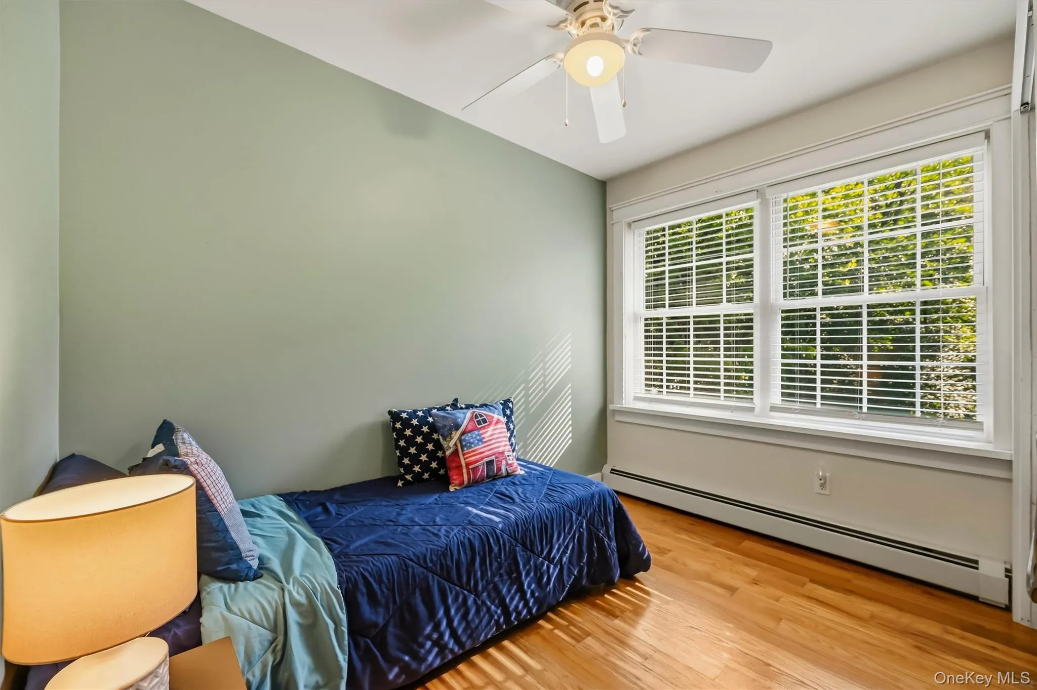 Light-filled guest bedroom with laundry facilities (not pictured). Light-filled guest bedroom with laundry facilities (not pictured).