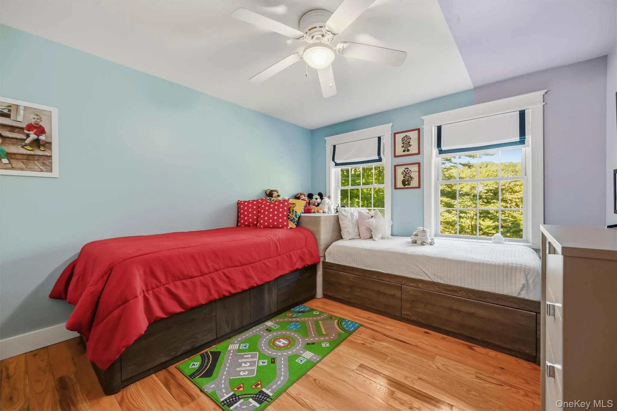 Bright and inviting bedroom with lake views. Bright and inviting bedroom with lake views.