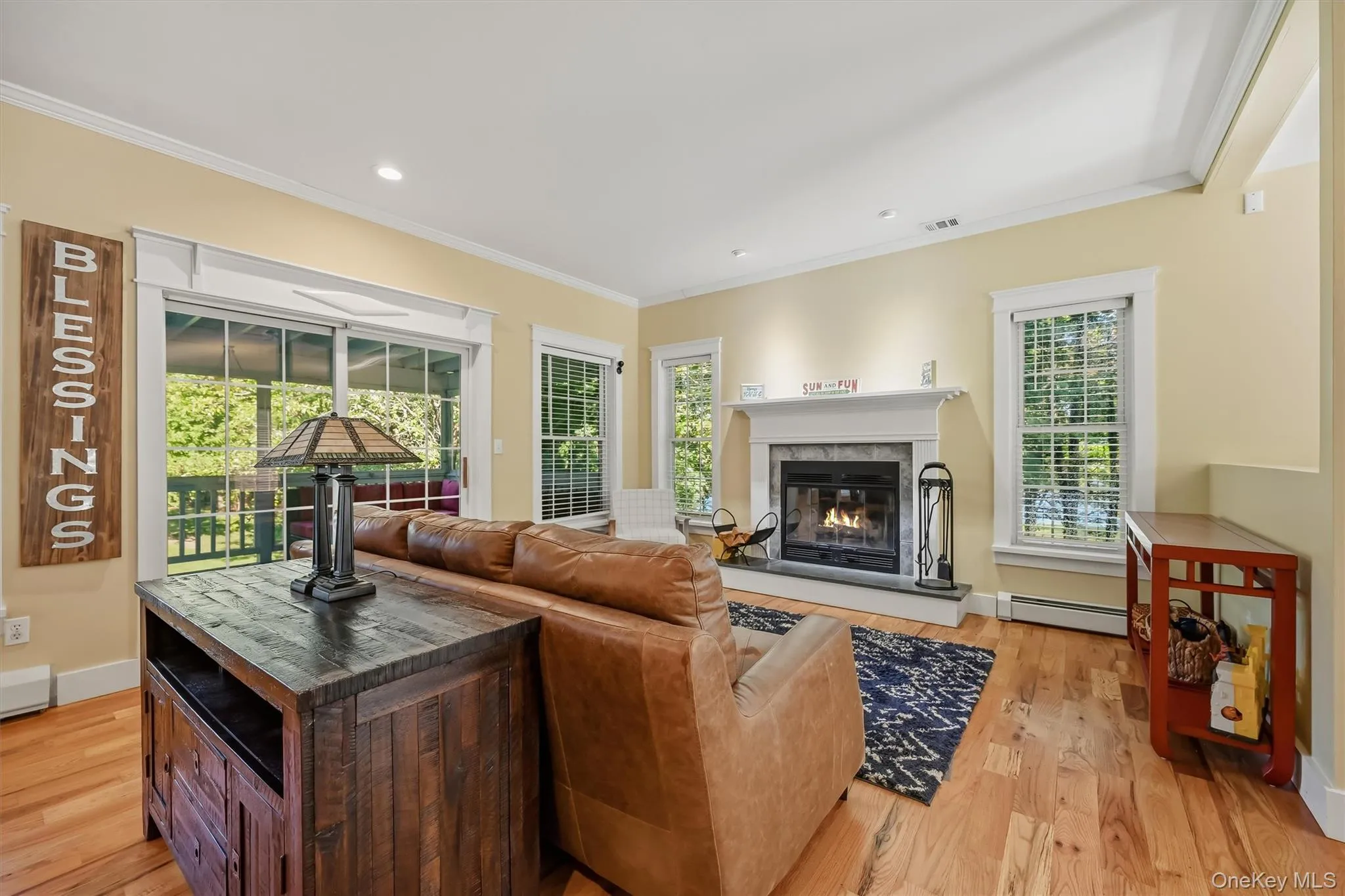 Warm and welcoming family room with fireplace, recessed lighting, and easy access to the screened-in deck. Warm and welcoming family room with fireplace, recessed lighting, and easy access to the screened-in deck.