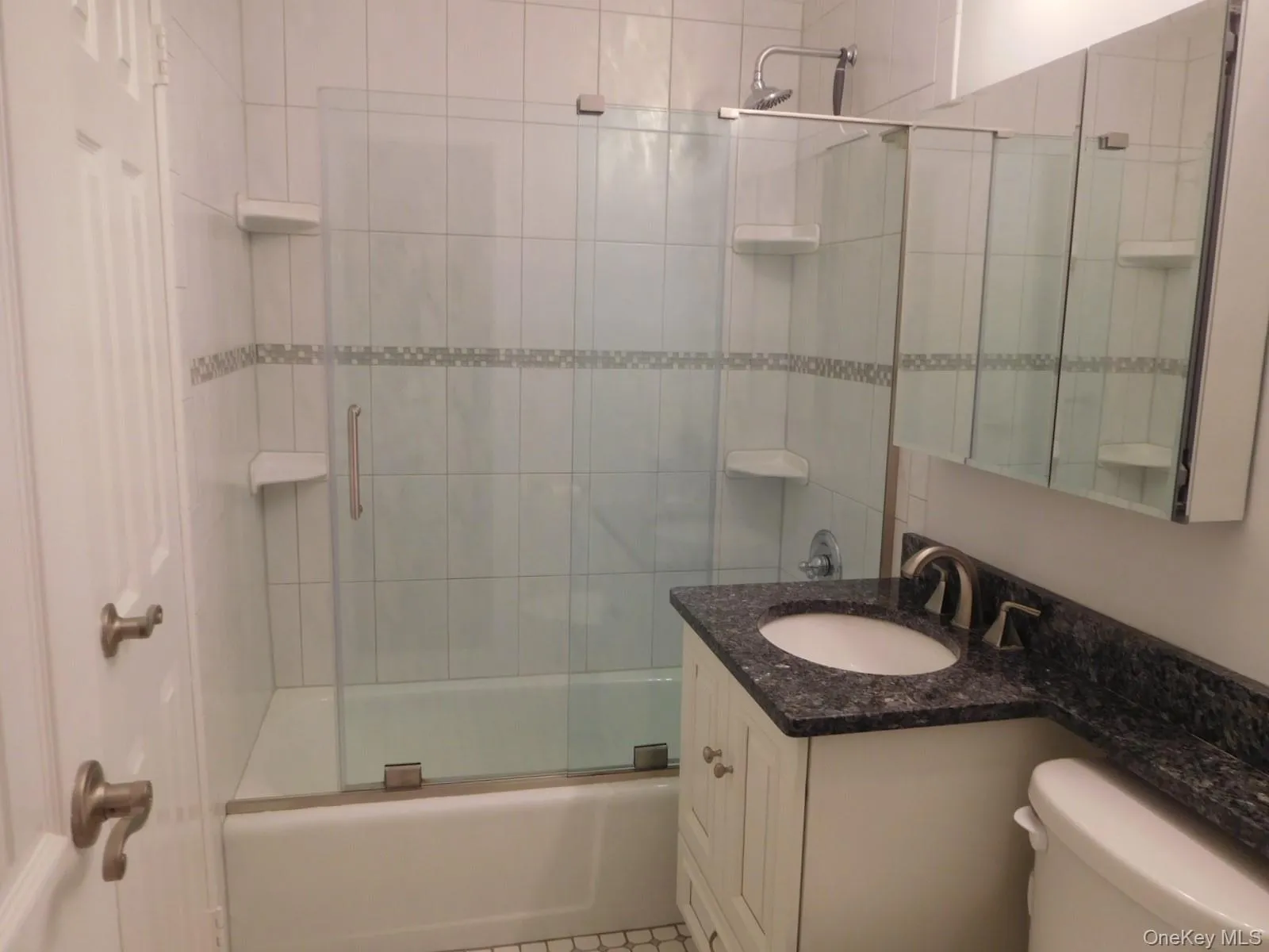 Renovated Bathroom with beautiful shower doors Renovated Bathroom with beautiful shower doors