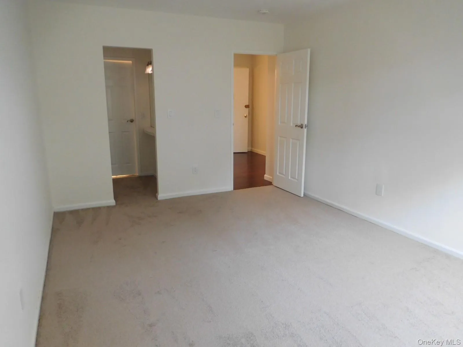 Opposite view of Primary Bedroom w/new carpet Opposite view of Primary Bedroom w/new carpet