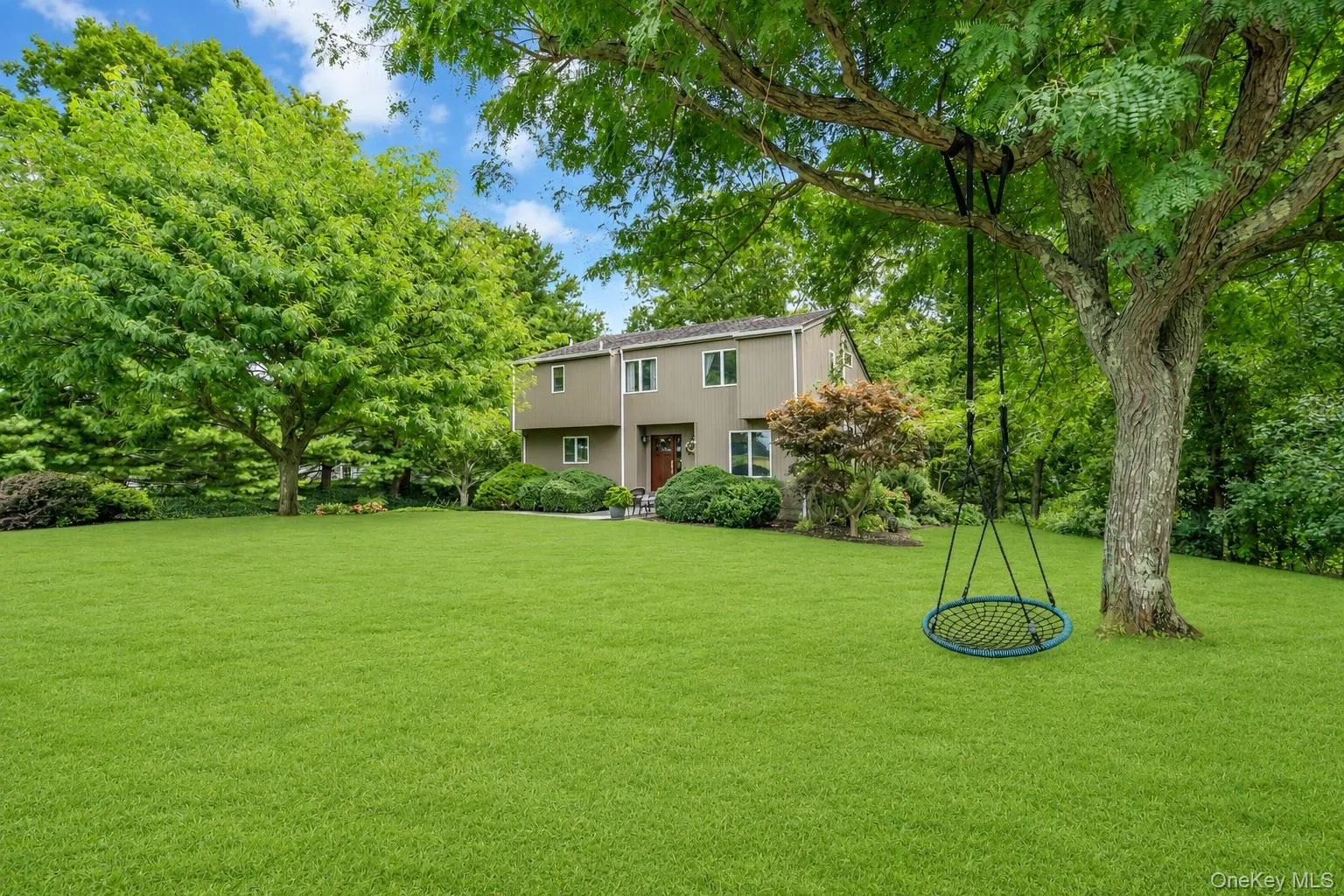 Beautiful front yard with shady tree, swing and stunning sunsets Beautiful front yard with shady tree, swing and stunning sunsets