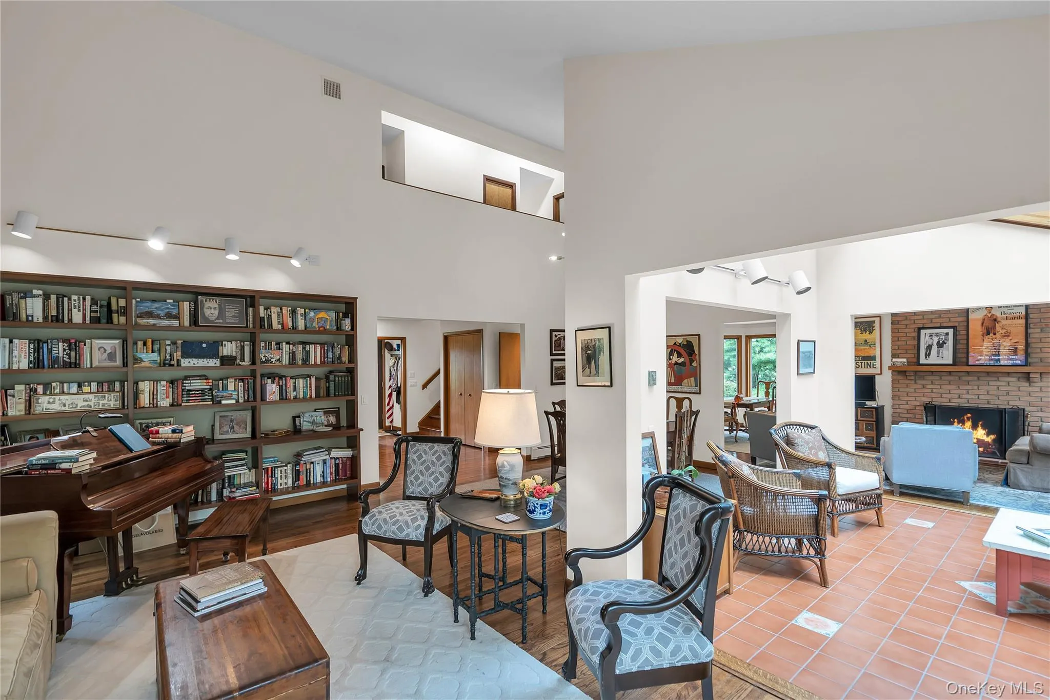 Second Living Room with a piano and library area. Built in bookcases and lighting Second Living Room with a piano and library area. Built in bookcases and lighting