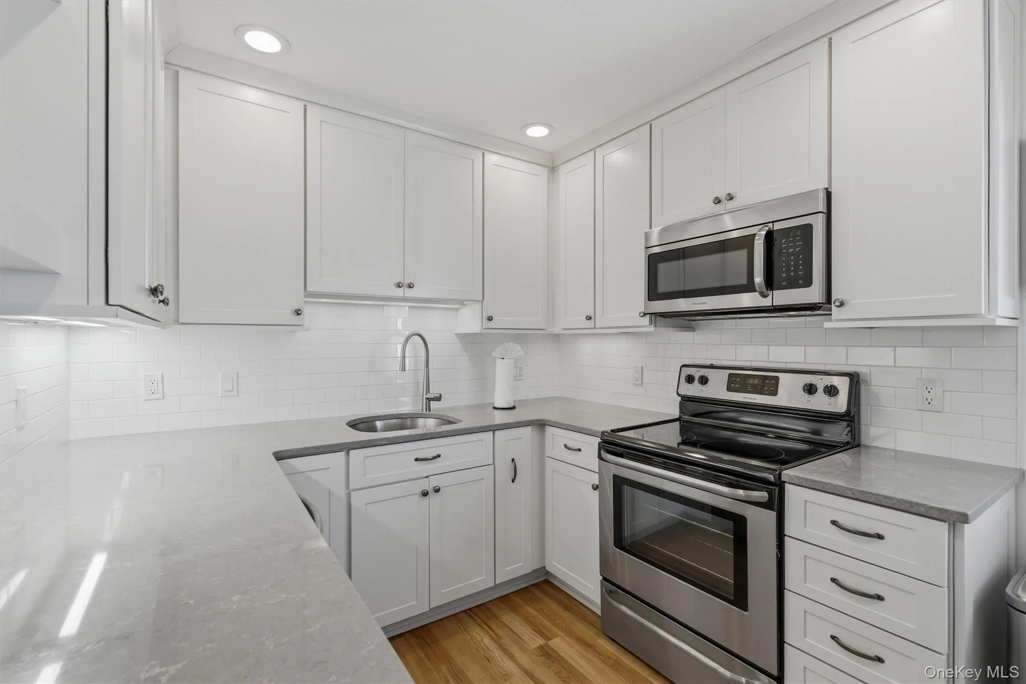 A stylish eat-in kitchen designed for both casual meals and conversation A stylish eat-in kitchen designed for both casual meals and conversation