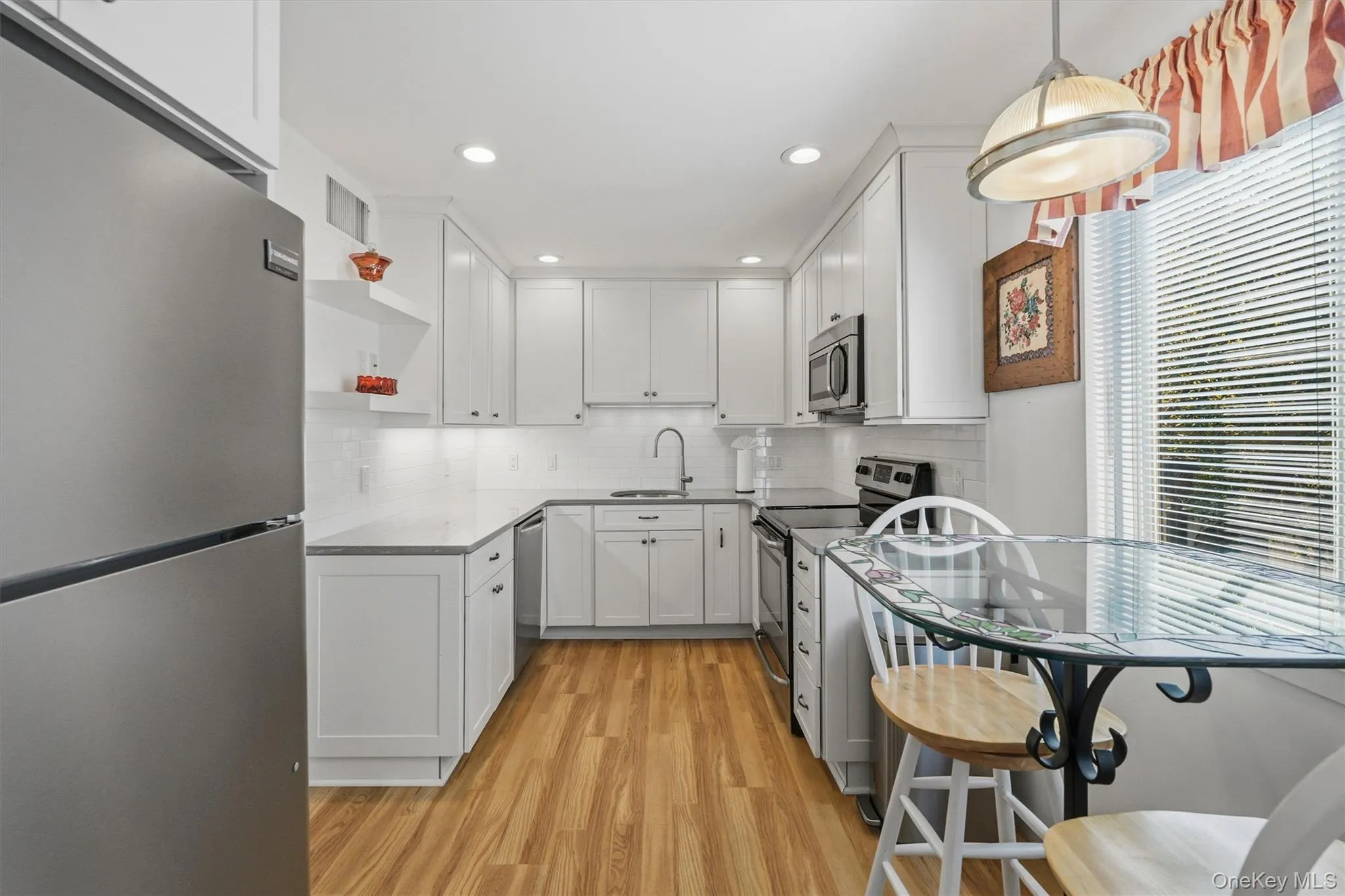 Crisp white cabinetry brings a bright, contemporary feel to the heart of the home Crisp white cabinetry brings a bright, contemporary feel to the heart of the home
