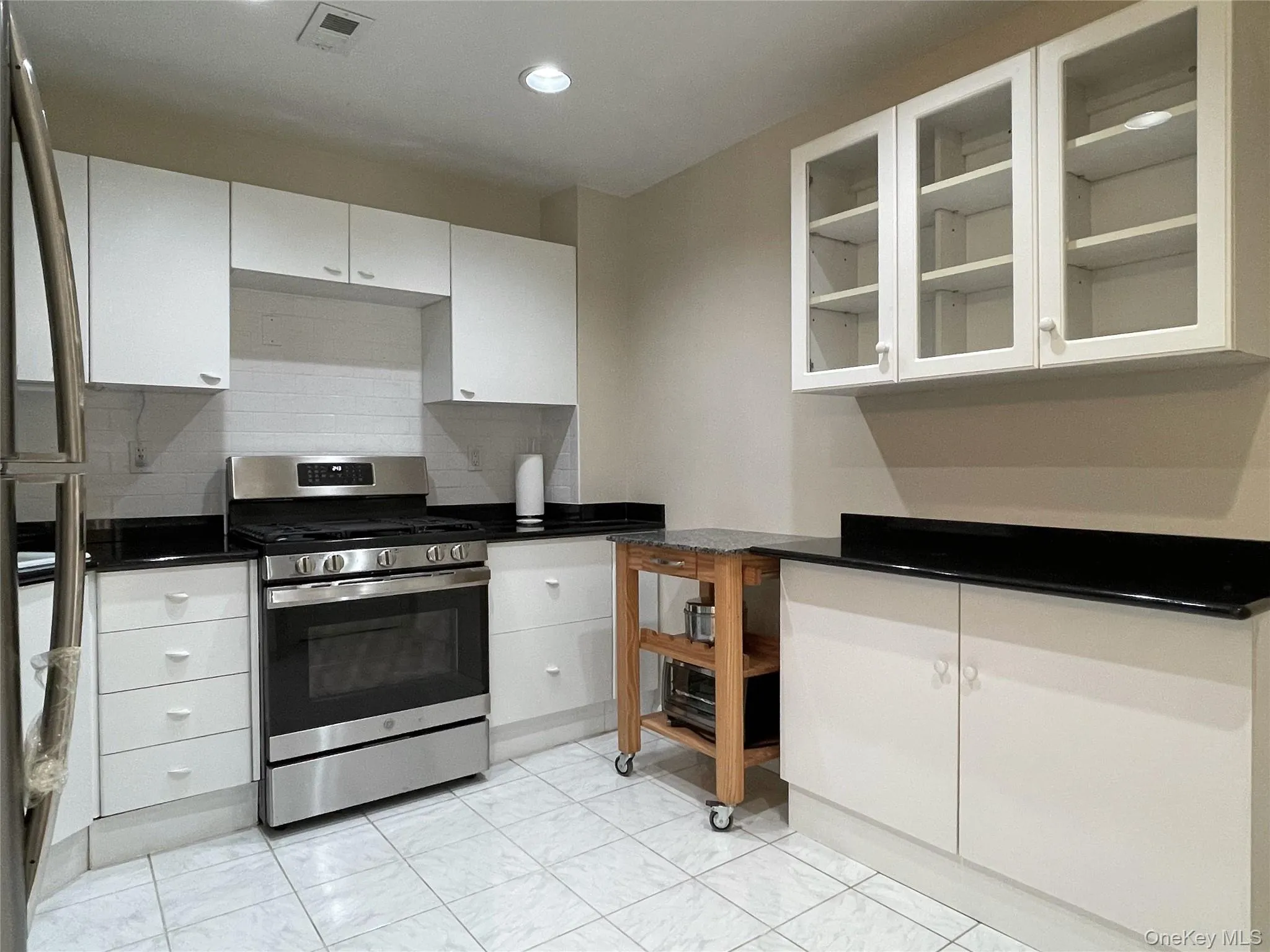 Updated kitchen with granite counter and stainless steel appliances. Updated kitchen with granite counter and stainless steel appliances.