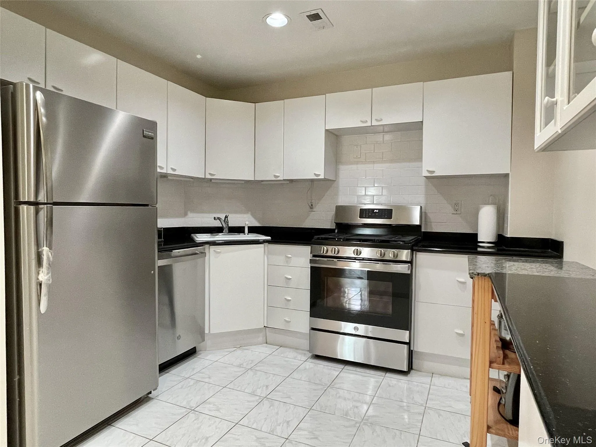 Updated kitchen with granite counter and stainless steel appliances. Updated kitchen with granite counter and stainless steel appliances.