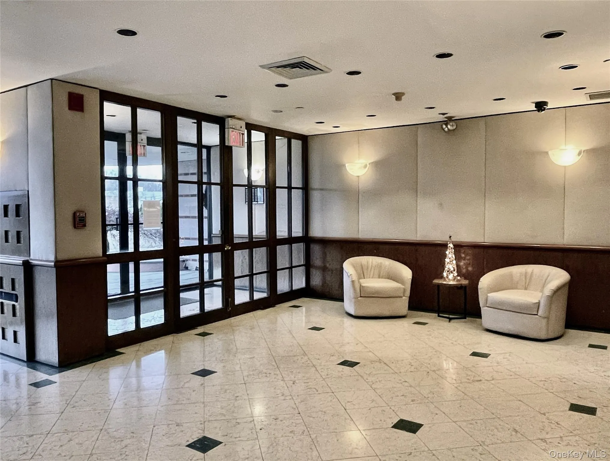 Beautiful Lobby with marble flooring and wood paneling. Beautiful Lobby with marble flooring and wood paneling.