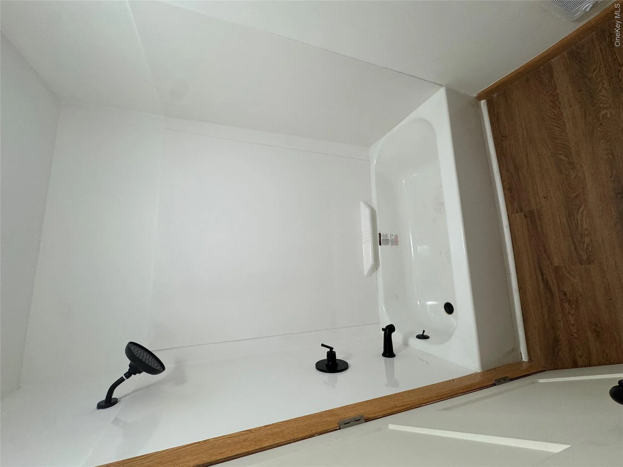 newly renovated bathroom, full tub with shower newly renovated bathroom, full tub with shower
