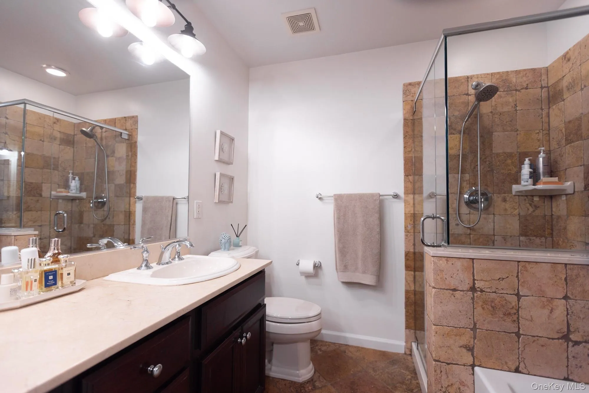 Tiled and glass shower. Soaking tub. Tiled and glass shower. Soaking tub.