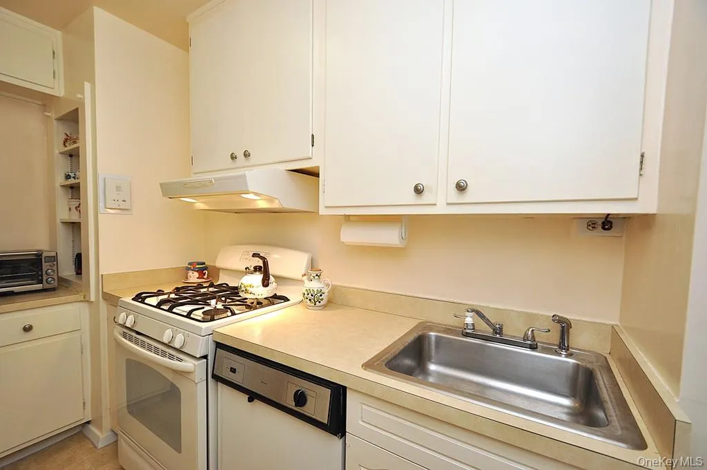 The kitchen has plenty of cabinets and counter space and even a window for natural light and ventilation. The kitchen has plenty of cabinets and counter space and even a window for natural light and ventilation.
