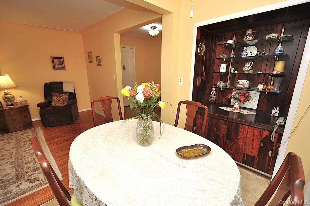 The dining area is just outside the kitchen and opens to the Living room. The dining area is just outside the kitchen and opens to the Living room.