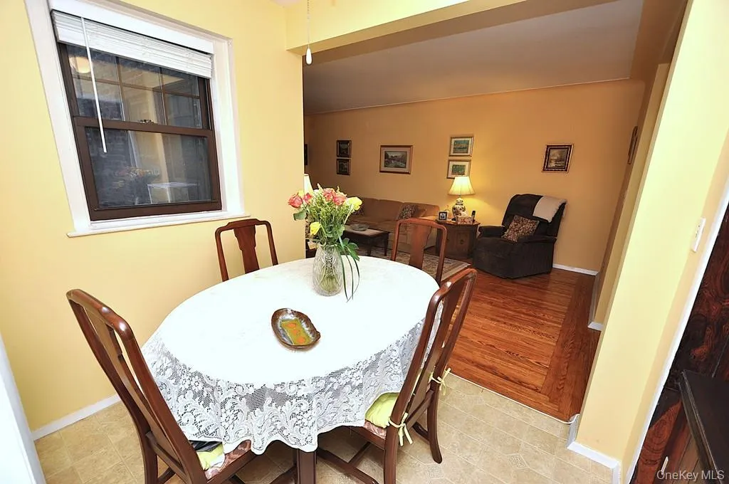 The dining area is just outside the kitchen and opens to the Living room. The dining area is just outside the kitchen and opens to the Living room.