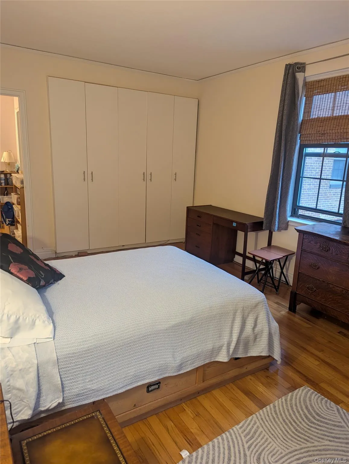 Primary bedroom with double exposure windows, beautiful wood floors, two double and one single closet. (almost ceiling height) Primary bedroom with double exposure windows, beautiful wood floors, two double and one single closet. (almost ceiling height)