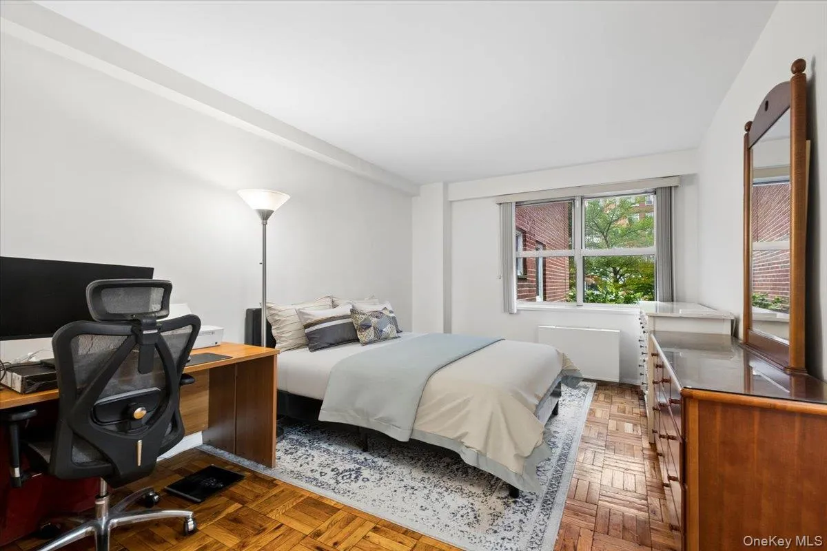 Spacious bedroom easily accommodates a second home office space Spacious bedroom easily accommodates a second home office space