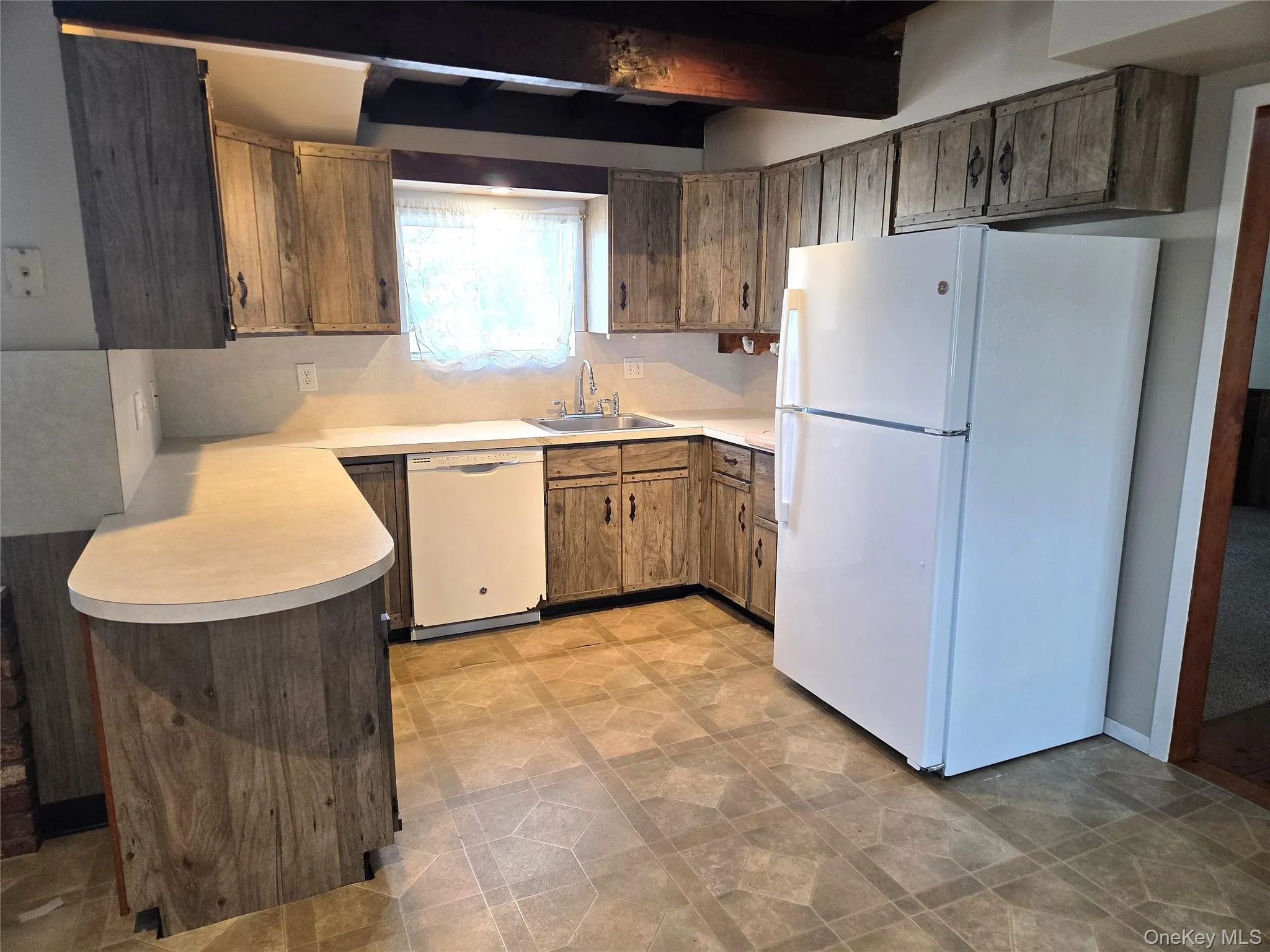 Large Eat In Kitchen With Original Beamed Ceilings, Walls Of Storage Cabinetry, A Separate Double Door Pantry, Ample Counter/Serving Space & Built In Barstool Area, Charming Brick Walls With A Built In Wall Oven & Separate Cooktop, Ample Room For A Good Sized Table & Chairs, And A Separate Mud Room With A Newer Full Sized Washer & Dryer, And Additional Storage/Cabinetry. Large Eat In Kitchen With Original Beamed Ceilings, Walls Of Storage Cabinetry, A Separate Double Door Pantry, Ample Counter/Serving Space & Built In Barstool Area, Charming Brick Walls With A Built In Wall Oven & Separate Cooktop, Ample Room For A Good Sized Table & Chairs, And A Separate Mud Room With A Newer Full Sized Washer & Dryer, And Additional Storage/Cabinetry.