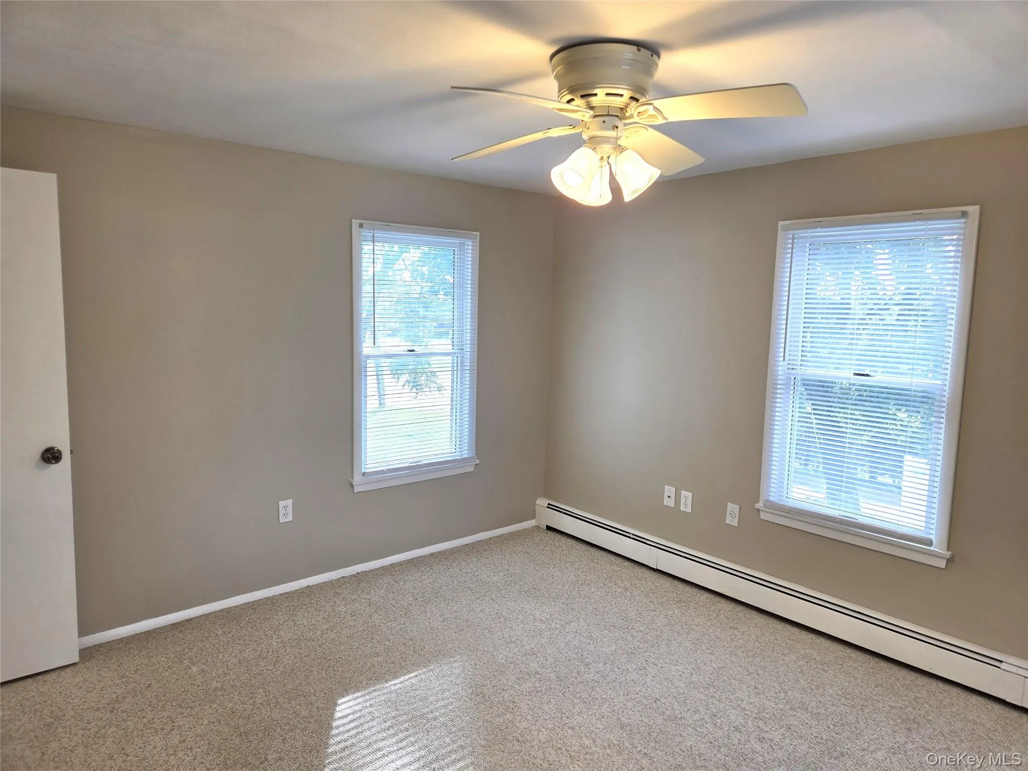 The Well Sized Primary Bedroom Has Just Been Freshly Painted, Has Two Double Sized Closets With Ample Storage, Three Large Windows For Natural Light & Room For A Good Sized Bedroom Set/Furniture. The Well Sized Primary Bedroom Has Just Been Freshly Painted, Has Two Double Sized Closets With Ample Storage, Three Large Windows For Natural Light & Room For A Good Sized Bedroom Set/Furniture.