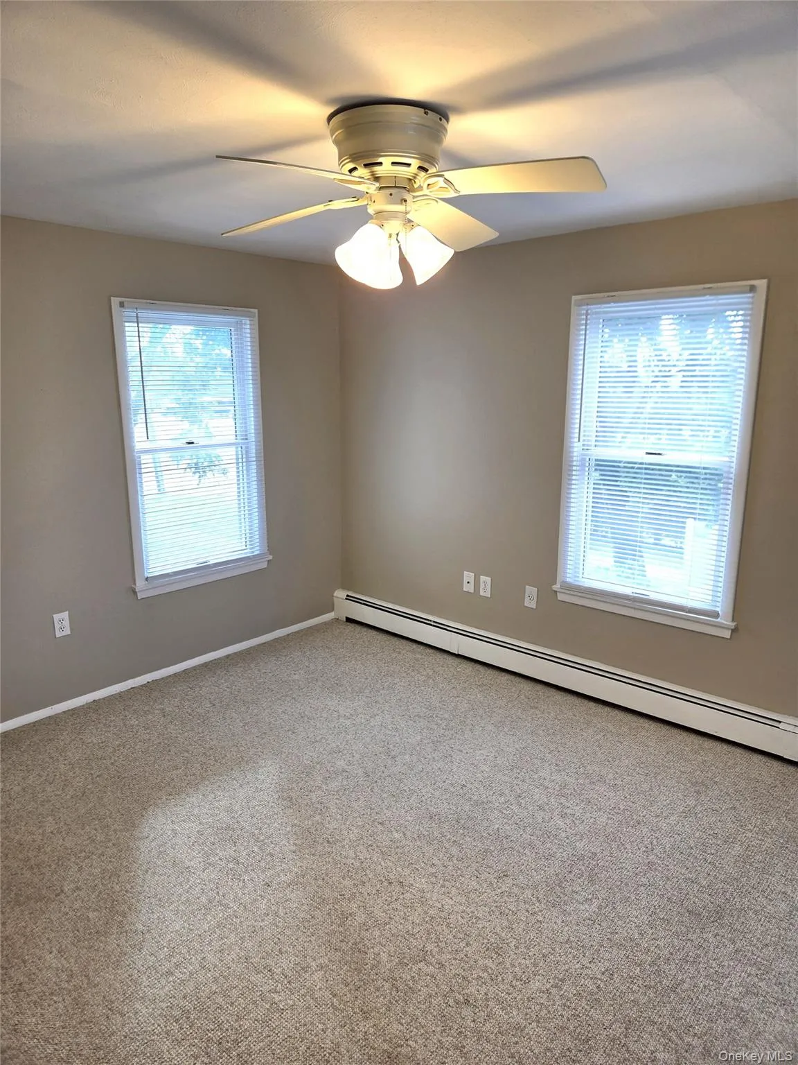 The Well Sized Primary Bedroom Has Just Been Freshly Painted, Has Two Double Sized Closets With Ample Storage, Three Large Windows For Natural Light & Room For A Good Sized Bedroom Set/Furniture. The Well Sized Primary Bedroom Has Just Been Freshly Painted, Has Two Double Sized Closets With Ample Storage, Three Large Windows For Natural Light & Room For A Good Sized Bedroom Set/Furniture.