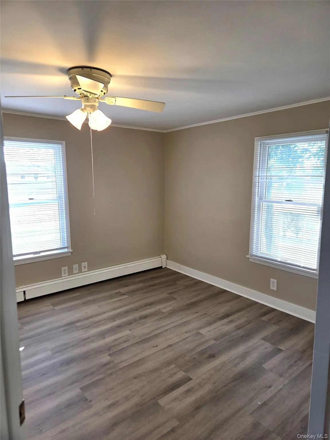 The Second Bedroom Is Well Sized With All New Luxury Vinyl Plank Flooring, Freshly Painted, Has Large Windows For Natural Light, A Ceiling Fan And Ample Room For A Good Sized Bedroom Set/Furniture. The Second Bedroom Is Well Sized With All New Luxury Vinyl Plank Flooring, Freshly Painted, Has Large Windows For Natural Light, A Ceiling Fan And Ample Room For A Good Sized Bedroom Set/Furniture.