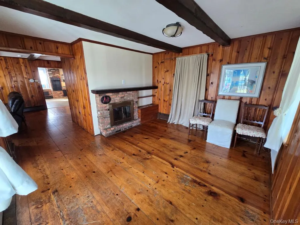 The Home Offers A Front Formal Dining Room Or Den/Sitting Room With Vintage Wide Plank Hardwood Floors, Original Beamed Ceilings, Tongue & Groove Pine Walls & So Much Character & Charm. The Home Offers A Front Formal Dining Room Or Den/Sitting Room With Vintage Wide Plank Hardwood Floors, Original Beamed Ceilings, Tongue & Groove Pine Walls & So Much Character & Charm.